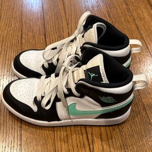 Nike Air Jordans Black and White High-Top Sneakers with Teal Accents